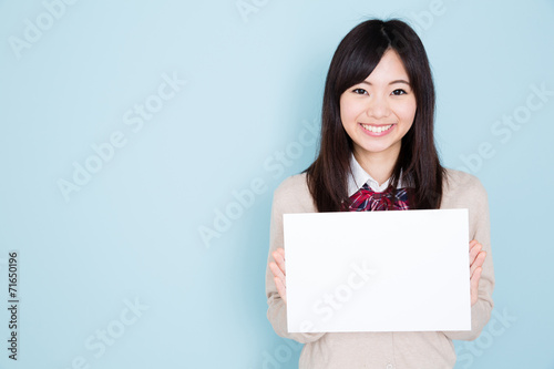 young asian woman on blue background