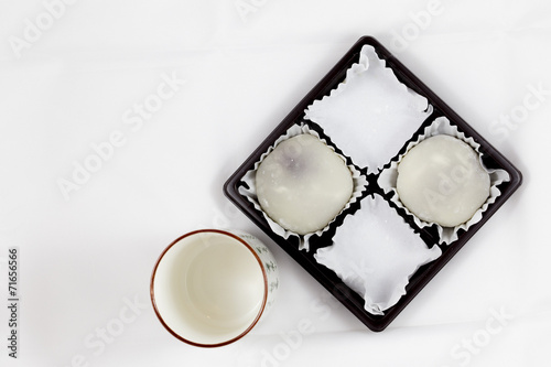 Half Pack of White Mochi and Empty Japanese Tea Cup