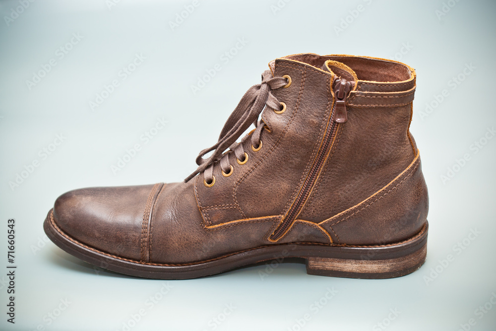 Expensive shoes autumn brown on gray abstract background