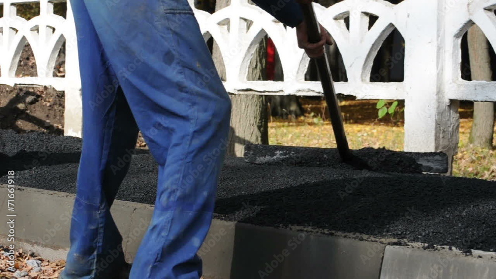 Asphalt paver applying asphalt on the way Asphalt paver applying asphalt on the way
