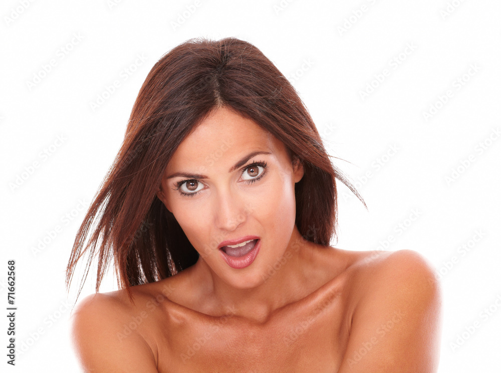 Surprised latin woman looking at camera