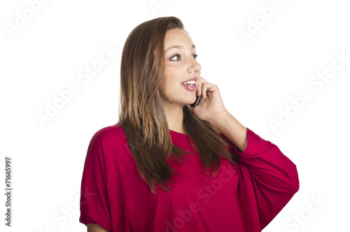 young smiling girl talks by mobile phone