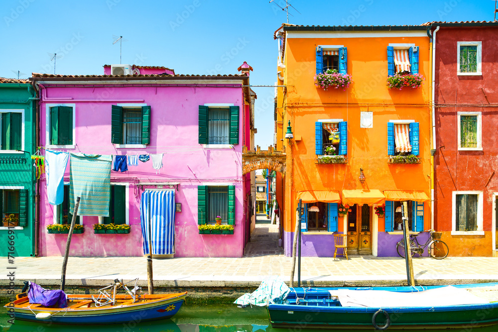 Fototapeta premium Venice landmark, Burano island canal, colorful houses and boat,