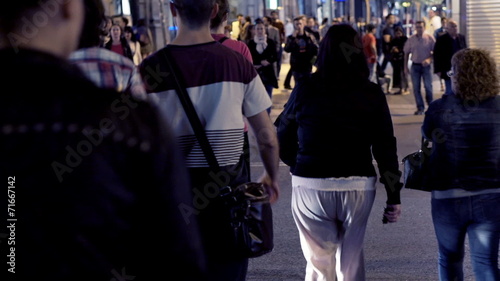 People crossing city street in madrid at night, EDITORIAL