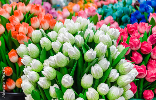 Traditional wooden colorful tulips at souvenir shop in Amsterdam