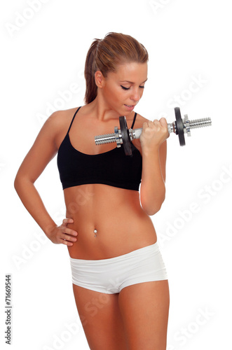 Attractive girl training with dumbbells