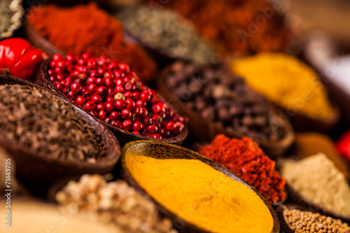 Spices in traditional Asian theme on wooden table