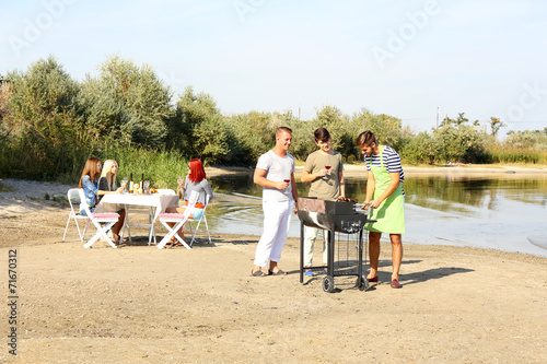 Young friends having barbec...