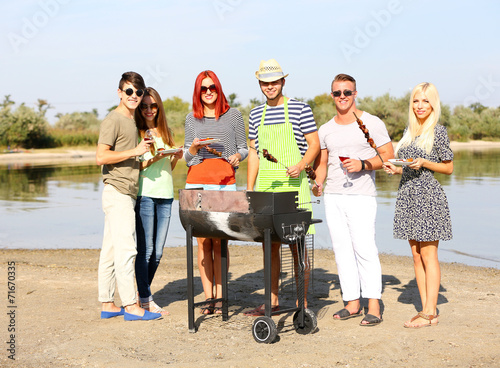 Young friends having barbec...