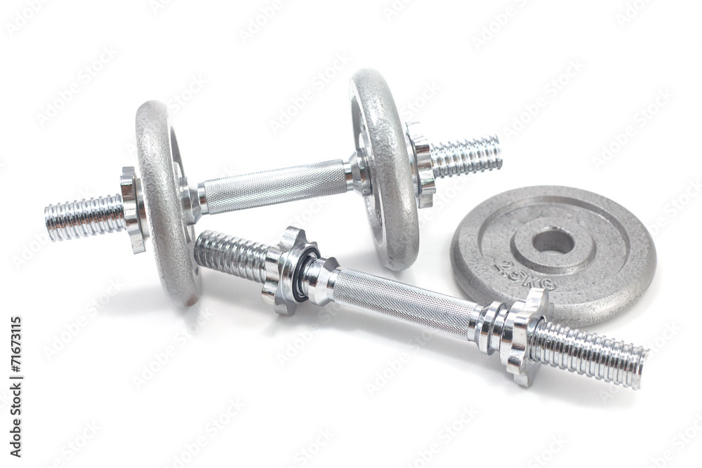Two Dumbbells and plate isolated on white background Two Dumbbells and plate isolated on white background