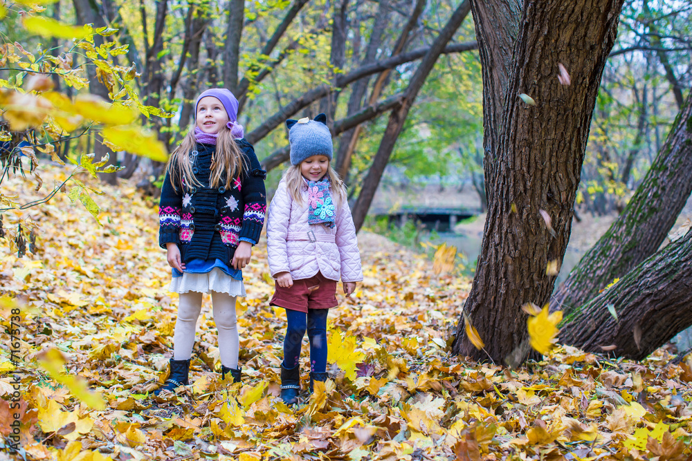 Two adorable girls outdoors in autumn forest Two adorable girls outdoors in autumn forest