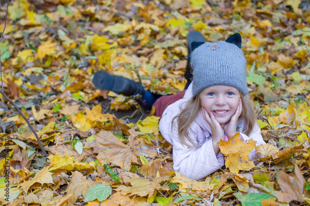 Adorable little girl at beautiful autumn day outdoors Adorable little girl at beautiful autumn day outdoors