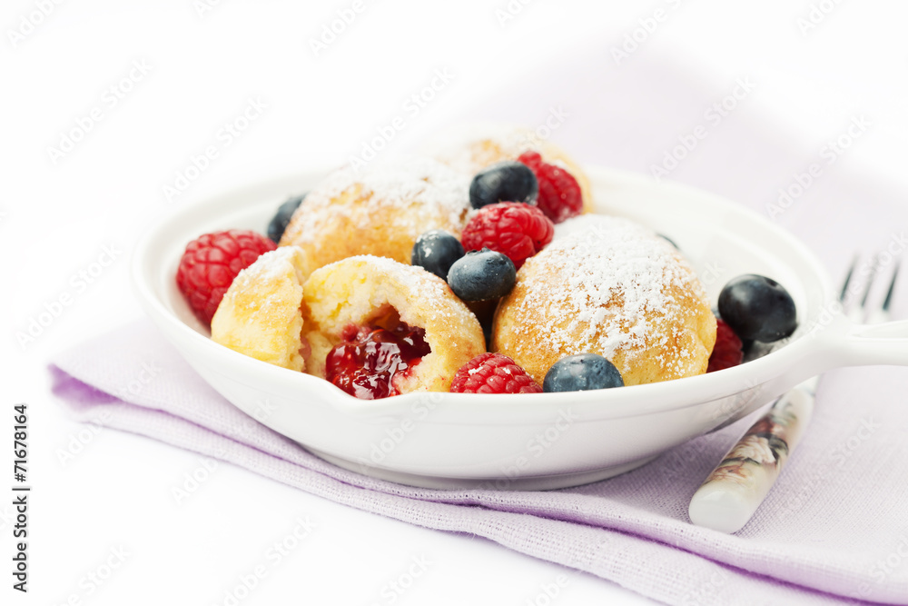 Traditional danish pancakes - ebelskivers with fresh berries Traditional danish pancakes - ebelskivers with fresh berries
