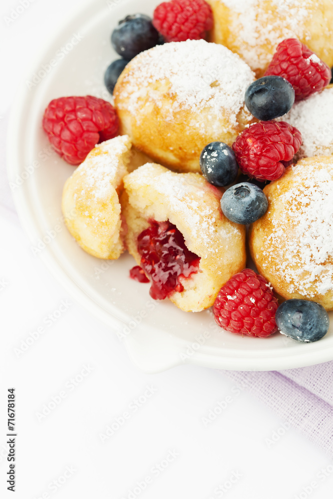 Traditional danish pancakes - ebelskivers with fresh berries Traditional danish pancakes - ebelskivers with fresh berries