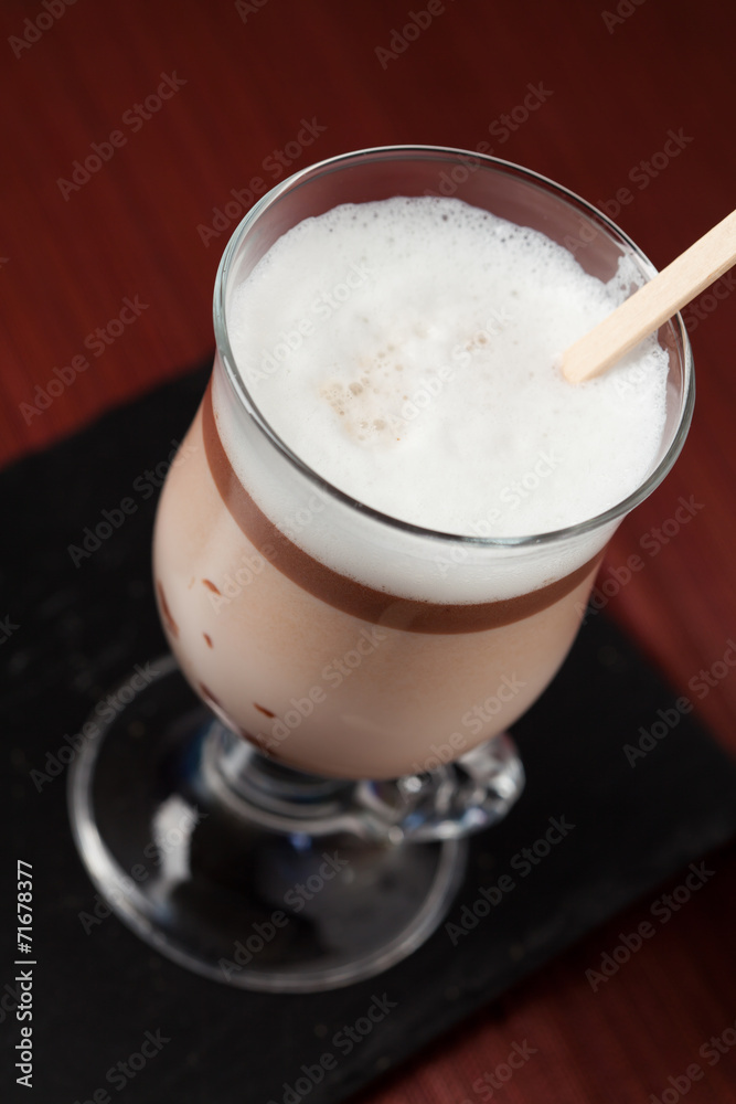 Hot chocolate in glass with chocolate on stick Hot chocolate in glass with chocolate on stick