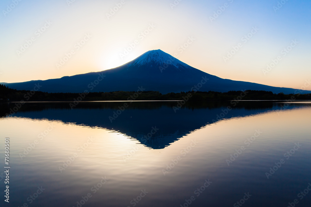 Silhouette of Mount Fuji reflected in Lake Tanukiko Silhouette of Mount Fuji reflected in Lake Tanukiko