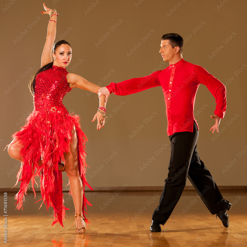 latino dance couple in action - dancing wild samba Stock-bilde | Adobe Stock