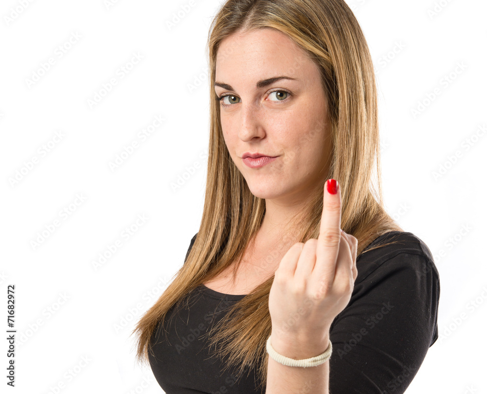 Girl making horn gesture over white background Girl making horn gesture over white background