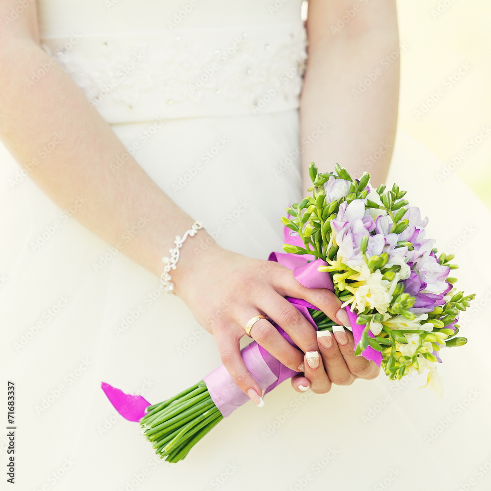 Wedding bunch of flowers in hands of the bride Wedding bunch of flowers in hands of the bride