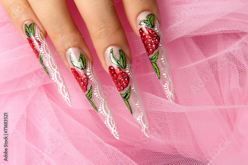 Nail design on a pink background.