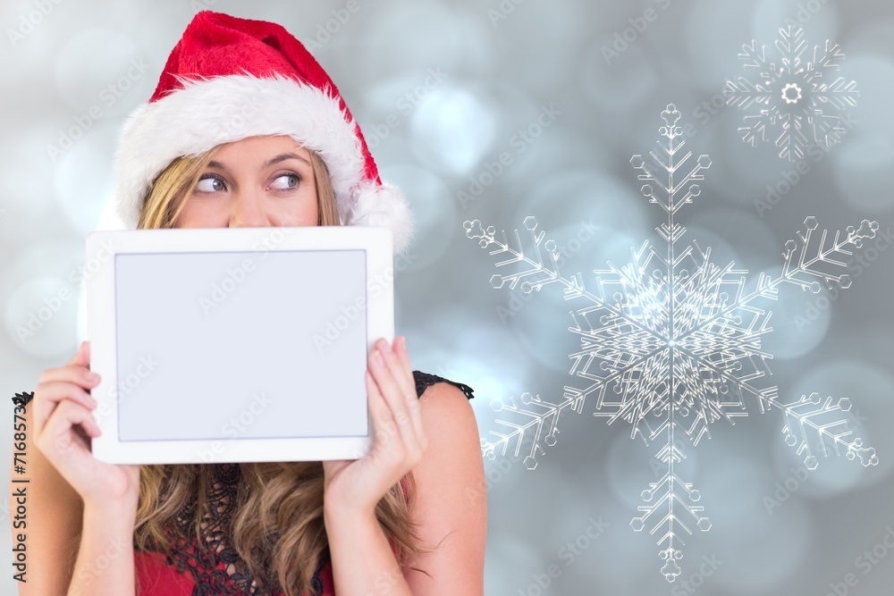 Composite image of festive blonde showing a tablet Composite image of festive blonde showing a tablet