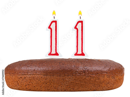 birthday cake with candles number 11 isolated on white