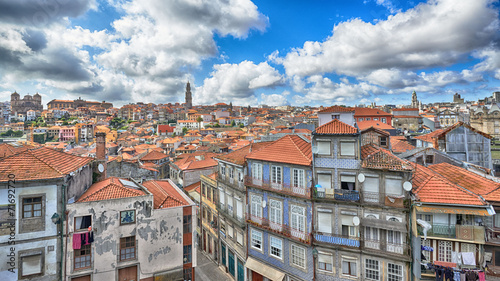 View of the city of Porto: houses around Riber and church Klerig photo