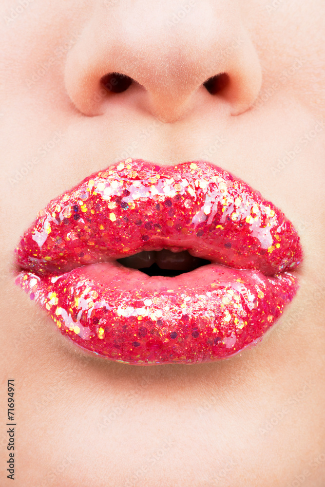 Fototapeta premium beautiful female lips with shiny red gloss lipstick