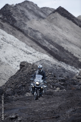 Man Riding Adventure Motorcycle Through Mud