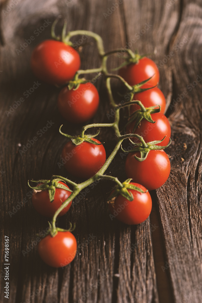 Tomatoes on wooden table Tomatoes on wooden table
