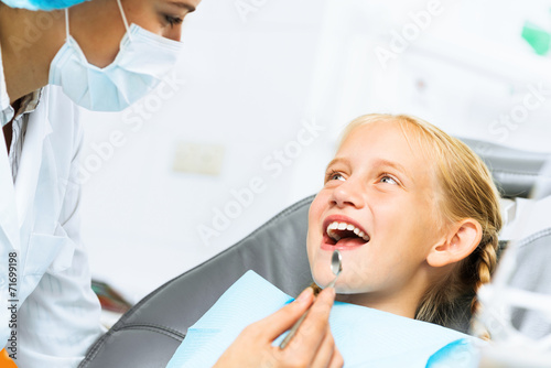 Dentist inspecting patient