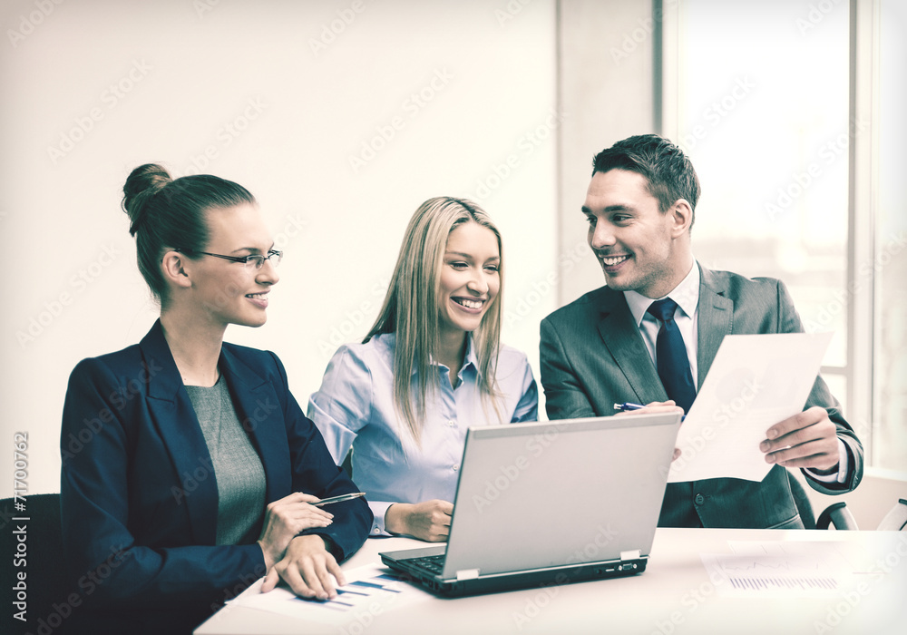 business team with laptop having discussion business team with laptop having discussion