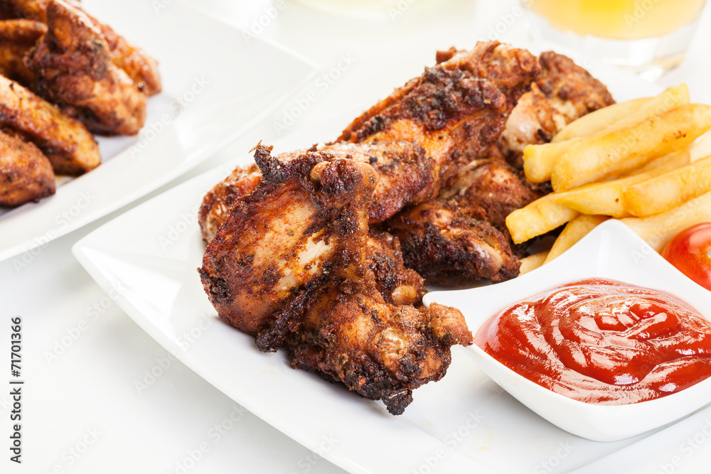 Chicken wings with fries french and spicy sauce Chicken wings with fries french and spicy sauce