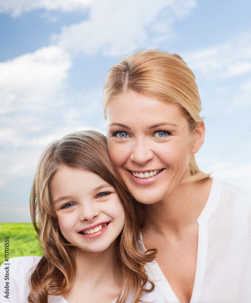 smiling mother and little girl smiling mother and little girl