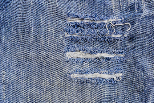 Foto texture of old blue jeans at torn