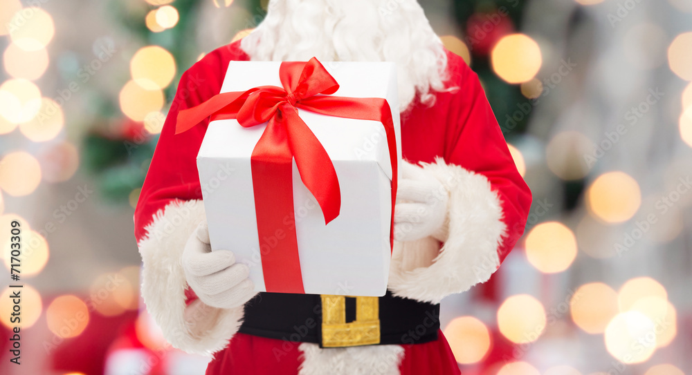 man in costume of santa claus with gift box man in costume of santa claus with gift box