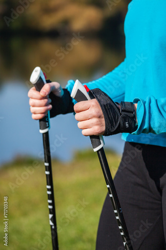 Closeup of woman's hand with nordic walking poles
