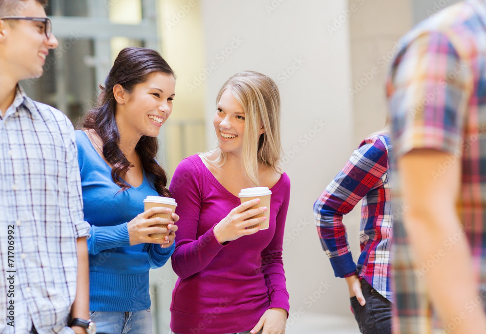 group of smiling students with paper coffee cups group of smiling students with paper coffee cups