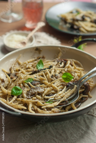 Freshly cooked pasta(trofie) with mushrooms, vegetable and parme