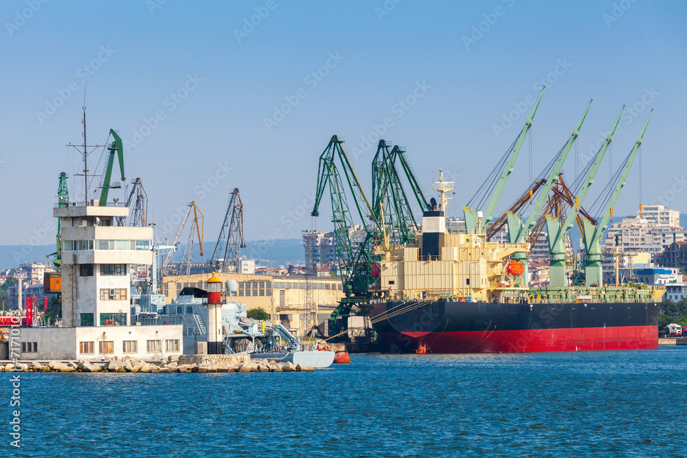Big industrial cargo ship is loading in port of Varna, Bulgaria