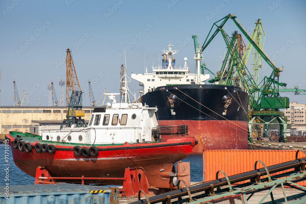 Red pilot boat stands on pier in Varna port, Bulgaria Red pilot boat stands on pier in Varna port, Bulgaria