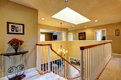 Luxury house interior. Upstairs hallway with staircase
