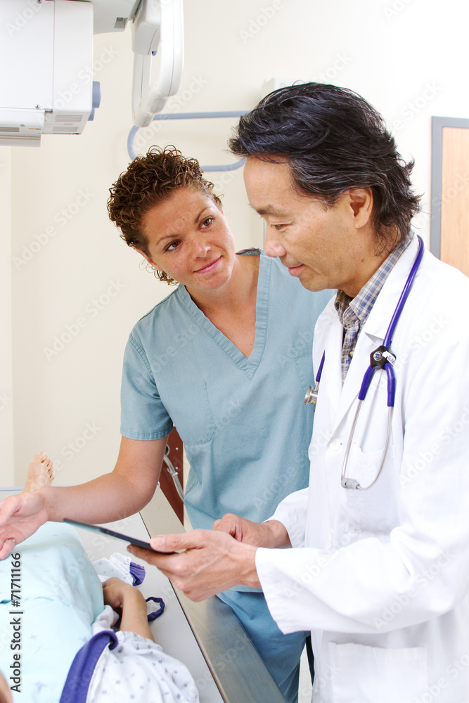 x-ray technician talking with radiologist x-ray technician talking with radiologist