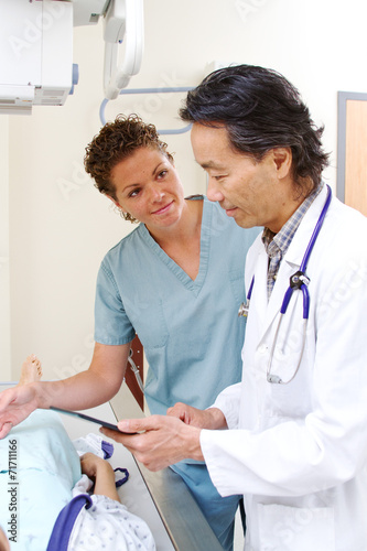 x-ray technician talking with radiologist