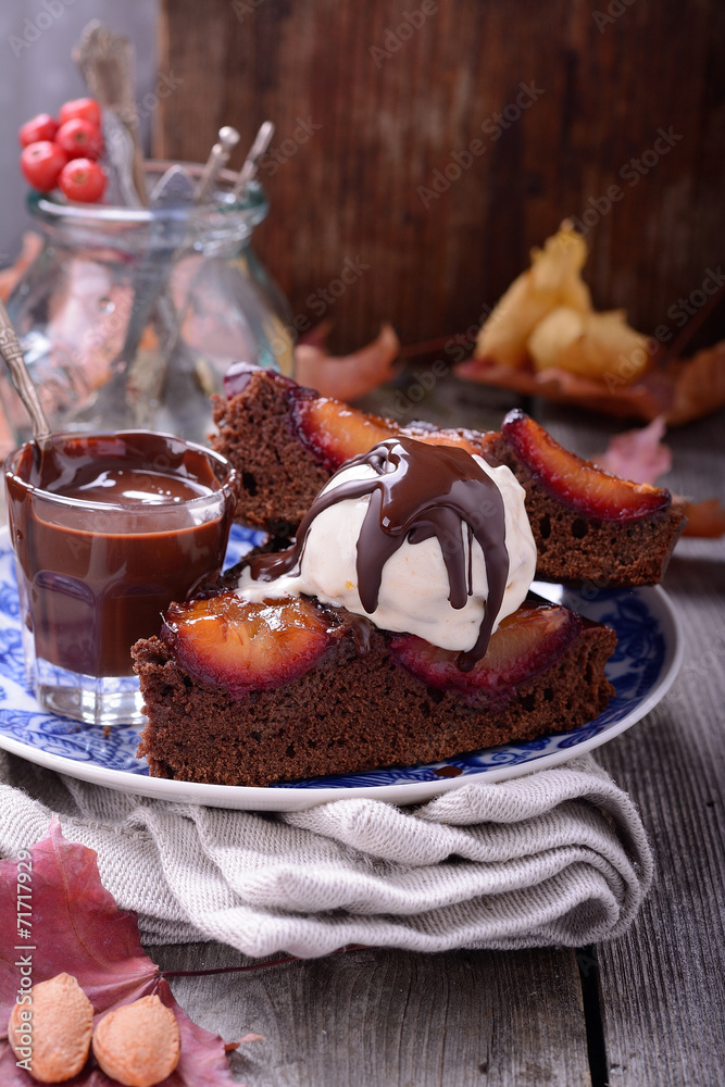 two pieces of chocolate cake with plums two pieces of chocolate cake with plums
