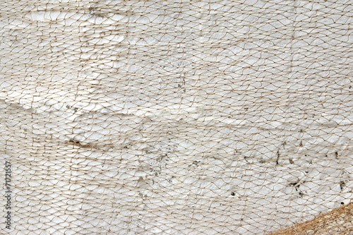 Old Fishing Net on White Wall