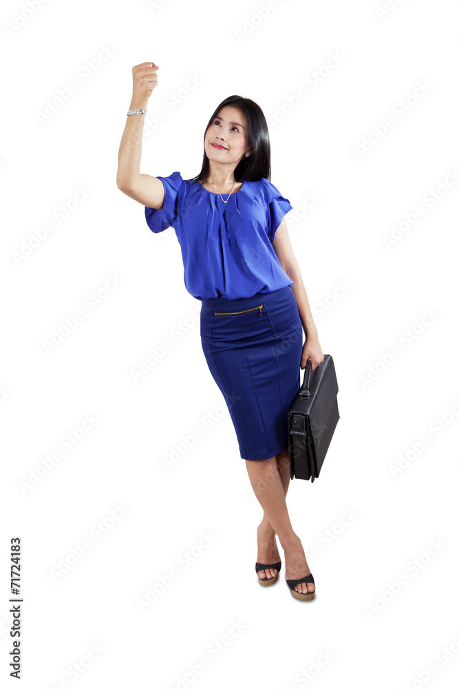 Businesswoman posing to pull something Businesswoman posing to pull something