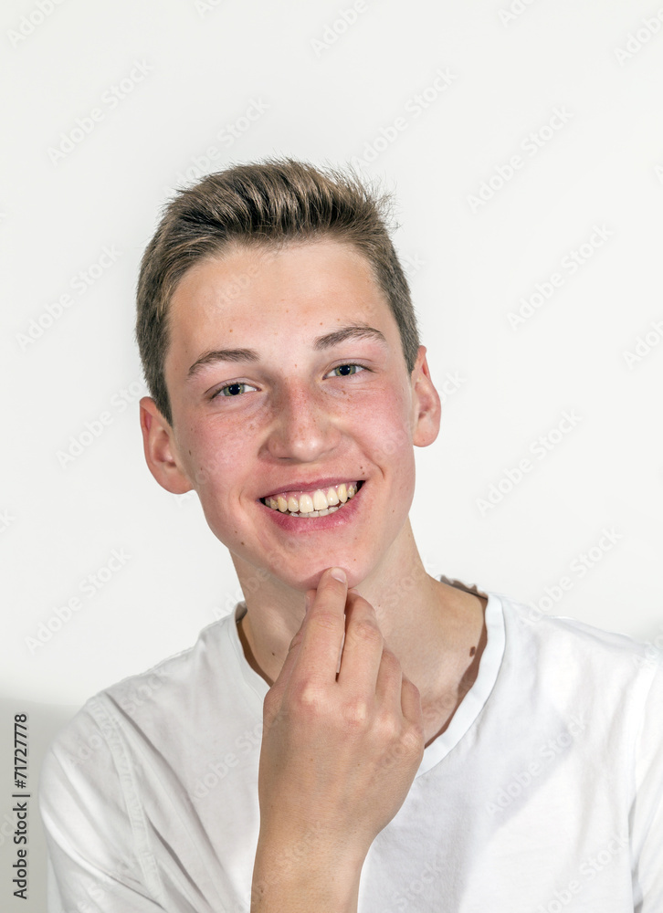 smiling happy caucasian teenage boy in studio smiling happy caucasian teenage boy in studio