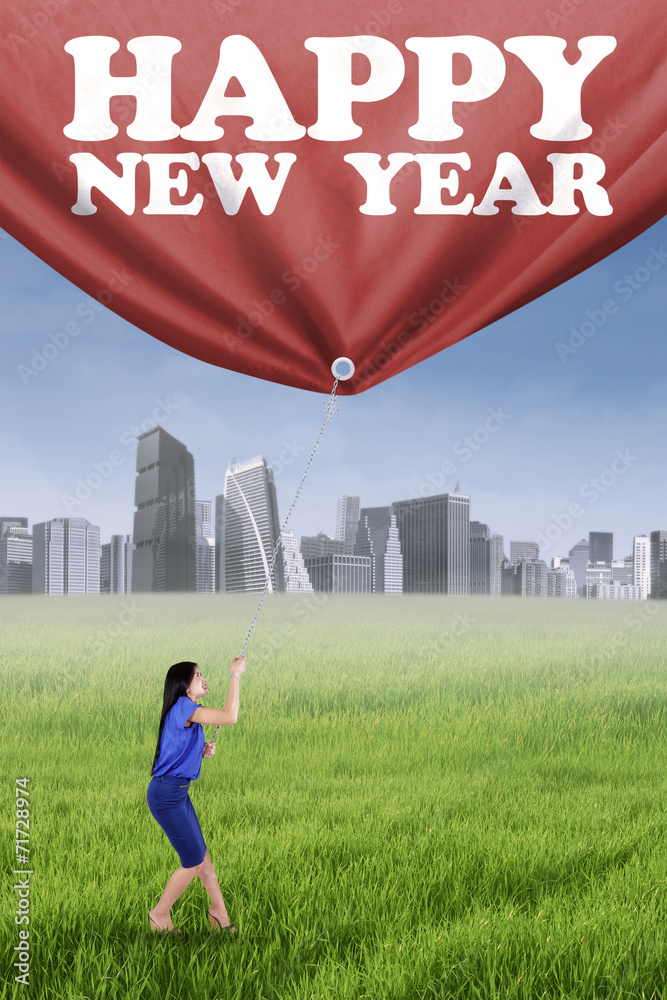 Woman and a banner of new year