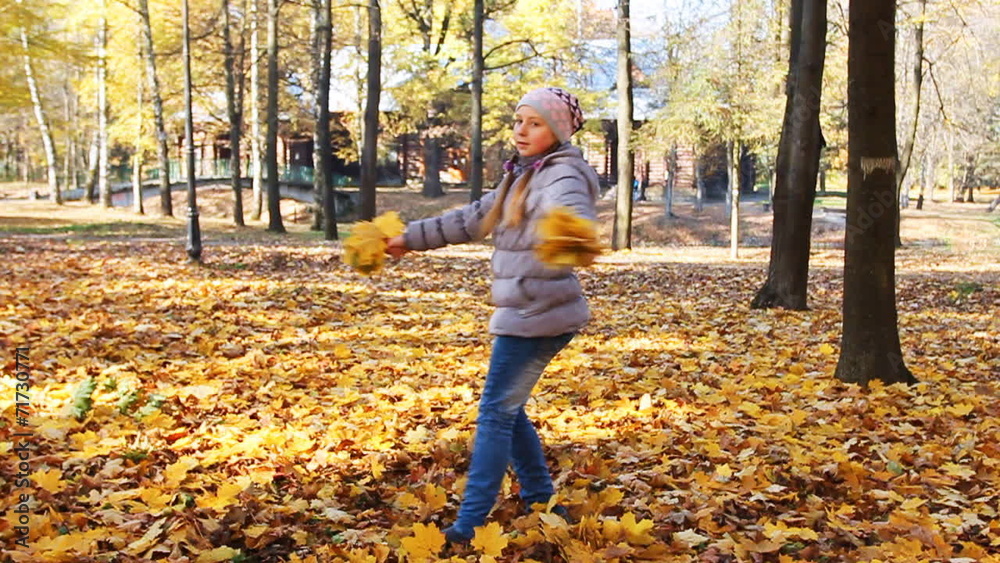 nice teen girl rotates with yellow leaves, slow motion nice teen girl rotates with yellow leaves, slow motion